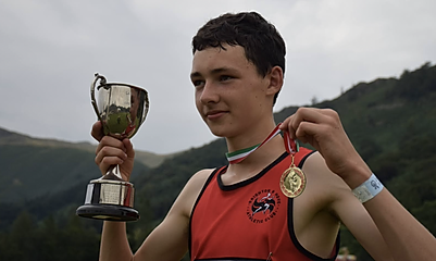 Finlay Goodman of Brighton & Hove, with cup and gold medal, pictured at Grasmere Sports 2022