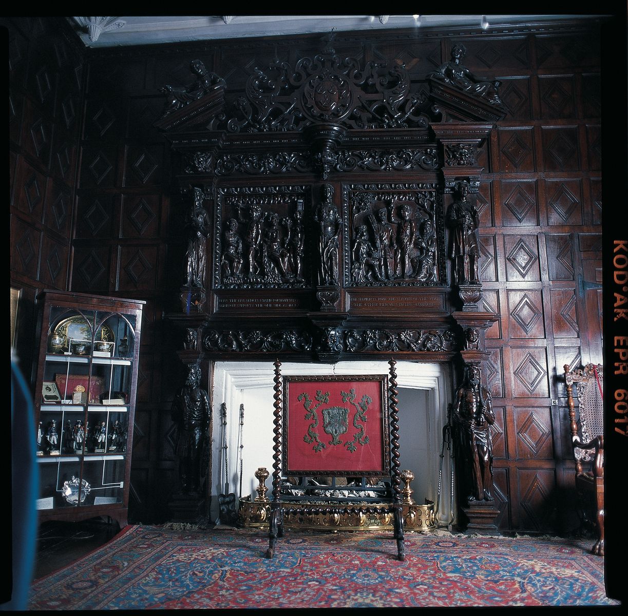The overmantel and fireplace in the Small Drawing Room at Levens Hall and Gardens, Cumbria, UK.