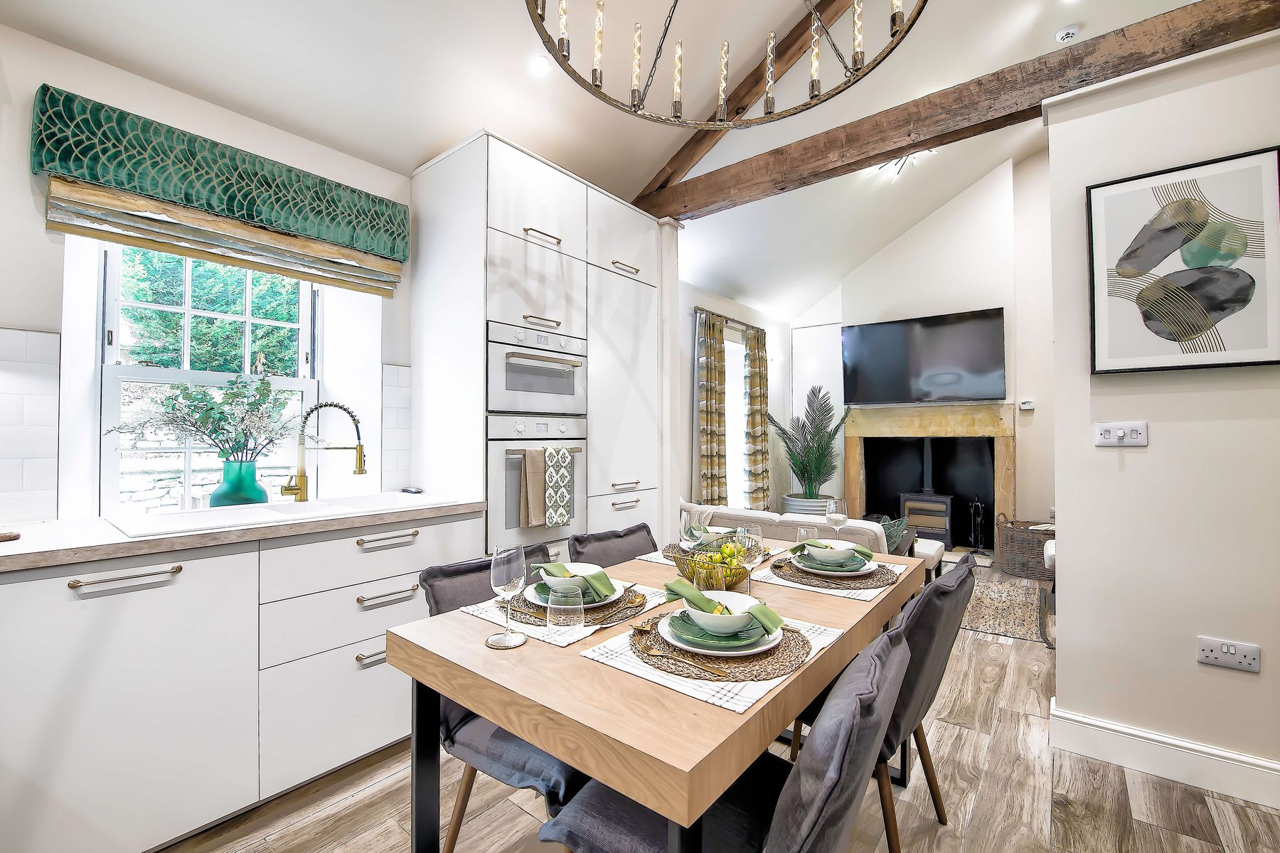 Beautifully equipped kitchen at the Toll Bar Luxury Villa at Langley Castle, Northumberland, UK, looking through to the open plan lounge area.