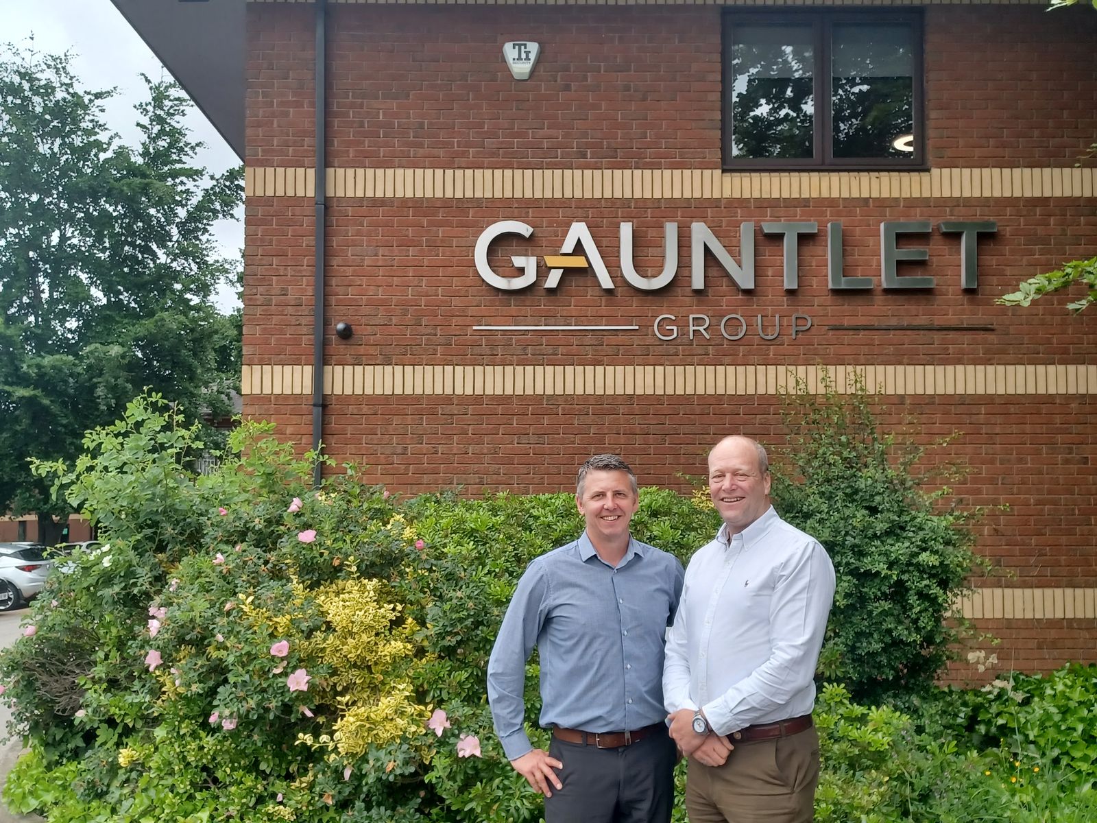 Paul Howley (the first broker from the Gauntlet Brokerage Builder programme) and Roger Gaunt,  outside the Gauntlet Group HQ in Leeds.