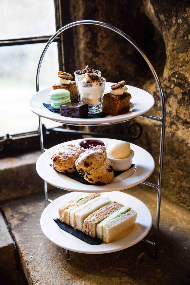 Afternoon tea set into the ancient walls of Langley Castle Hotel, Northumberland
