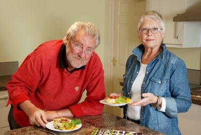 Couple eating vegetarian quiche