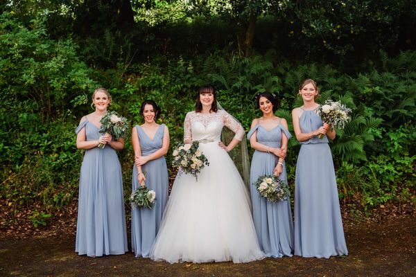 Bride and bridesmaids in the new Woodland Weddings area at Langley Castle Hotel, Northumberland
