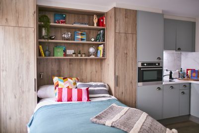 Room with kitchen area in view