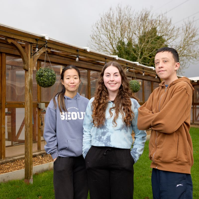 Moulton College students Anna and Lewis with Cloverlea Cattery's Hayley