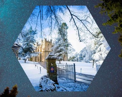 Langley Castle in winter in dark sky, starry night setting