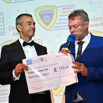 Steve Arnold from WMSAR receives charity donation from Dyslexia Awards host Paul Shuttleworth. .jpg