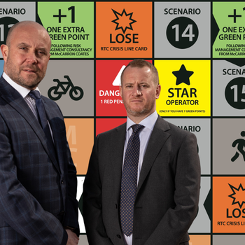 Paul Coates and Ian McCarron in front of the broker's new Road Hierarchy board game