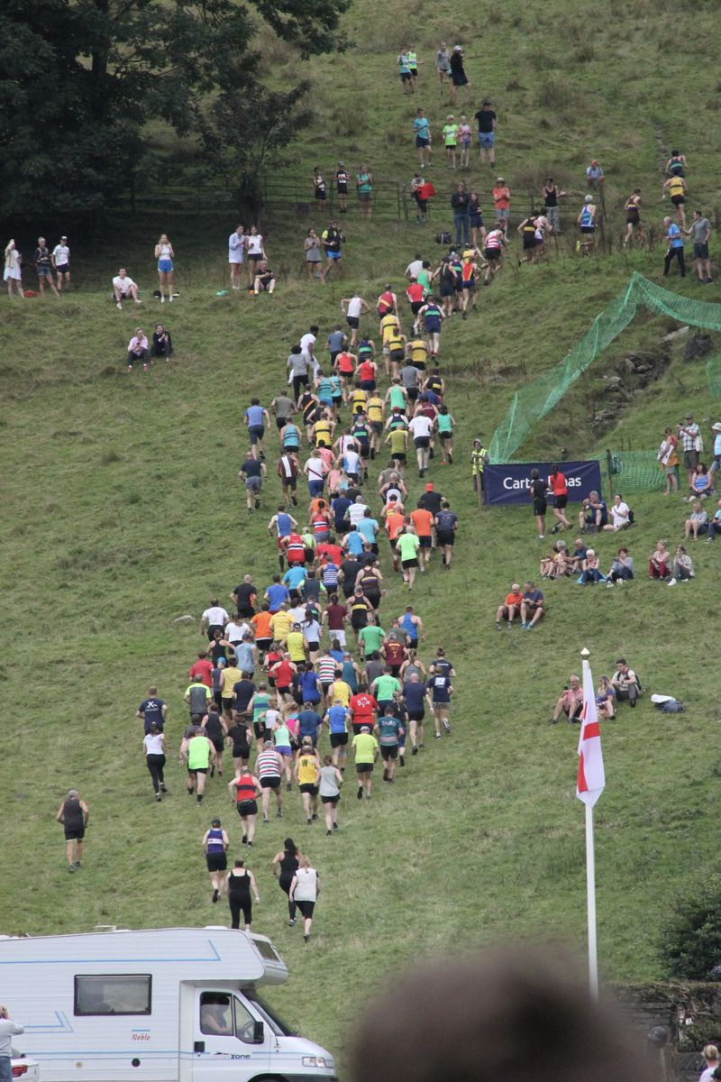 Runners heading up the fell at the start of a fell race at Grasmere Lakeland Sports and Show