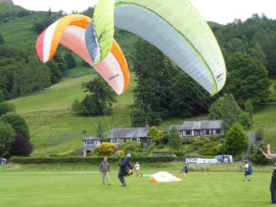 Paragliders on the Grasmere Lakeland Sports and Show show field.