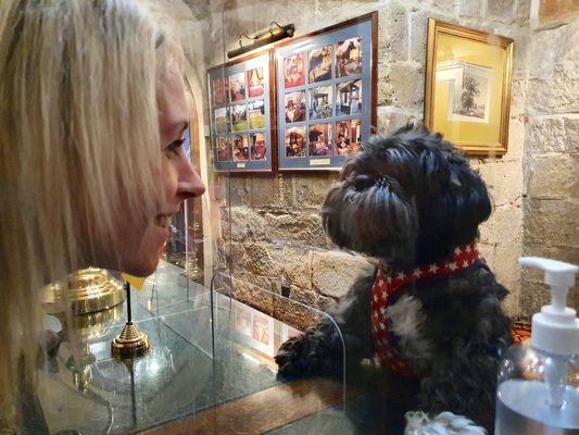 Laura Mooney checks doggy guest 'George' into Langley Castle Hotel