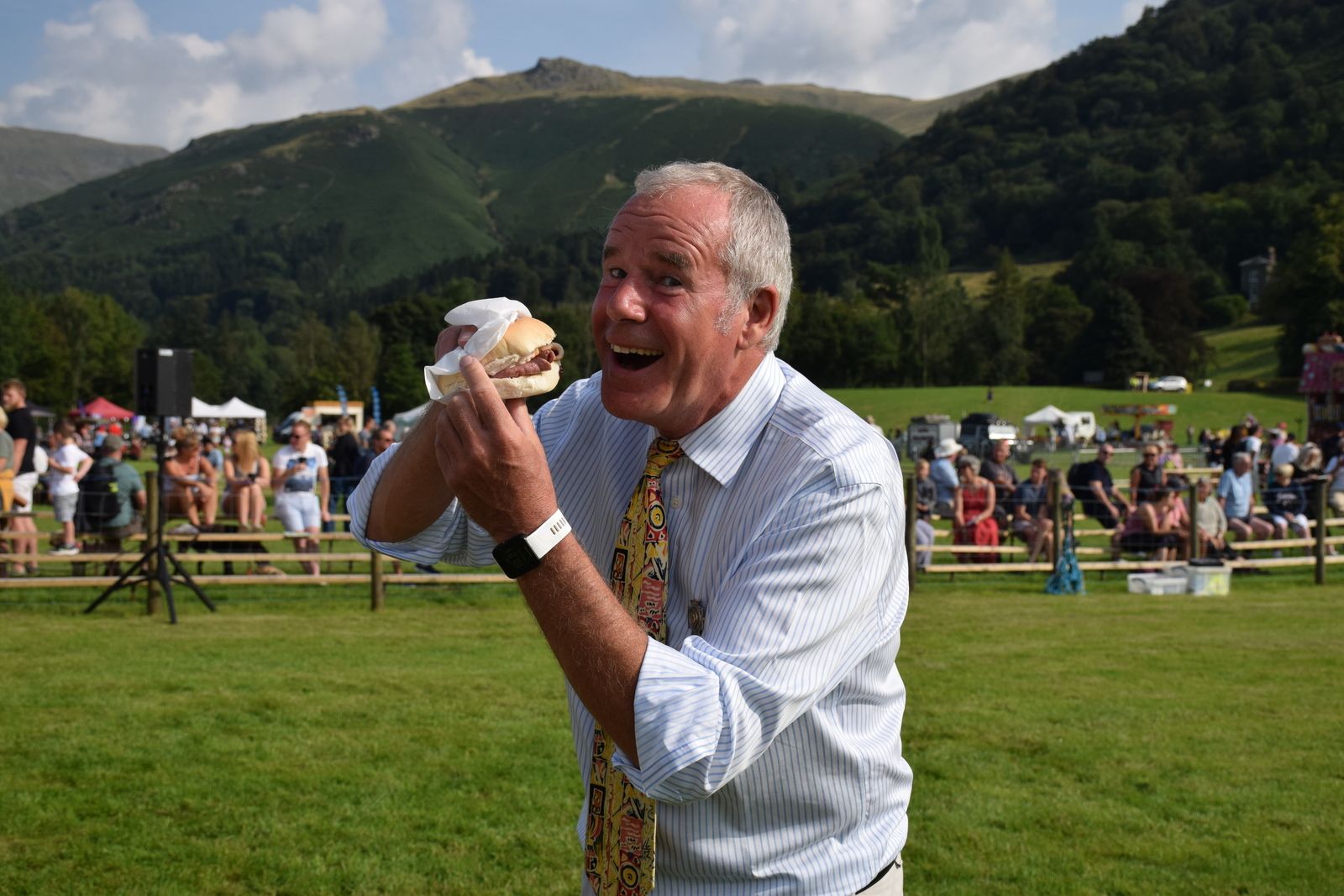 Show official eating burger at the Grasmere Lakeland Sports and Show