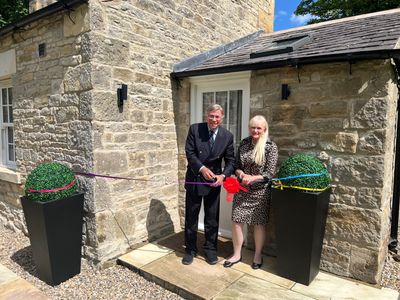 Dr Stuart and Dr Mariann Madnick, Baron and Baroness of Langley, perform the ribbon cutting at Toll Bar Luxury Villa, at Langley Castle, Northumberland, UK