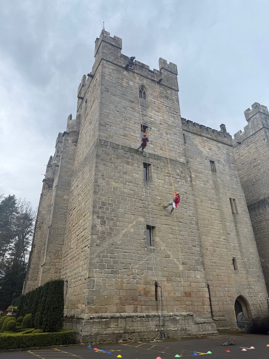 Bold knights scale Langley Castle's walls,