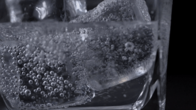 vecteezy_close-up-pouring-soft-drink-to-glass-with-ice_1622795.mp4