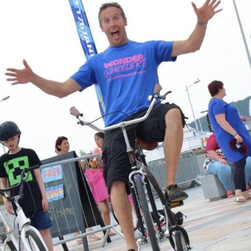Man riding one of the fun and whacky bikes from Wonder Wheelers
