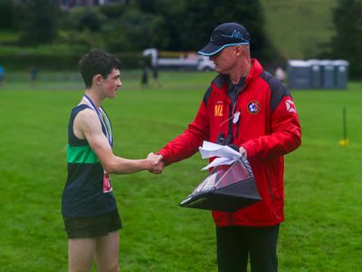 Zeke Sumner being presented with the Pete Bland bursary by Pete's son, Matt Bland