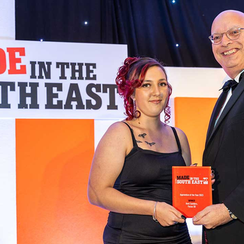 Anni Sanders is presented with Apprentice of the Year award by judge Mr Paul Hetherington