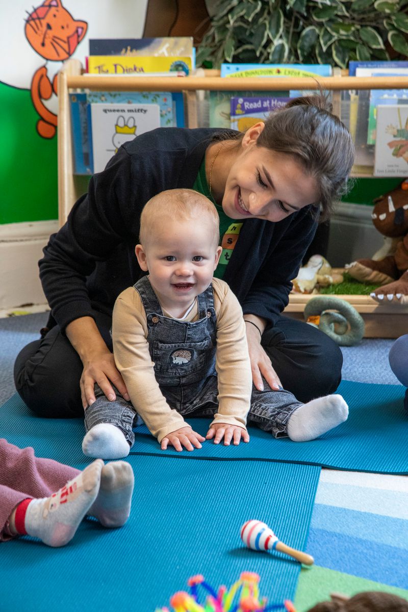 Hopscotch children, parents and staff take part in yoga.jpg
