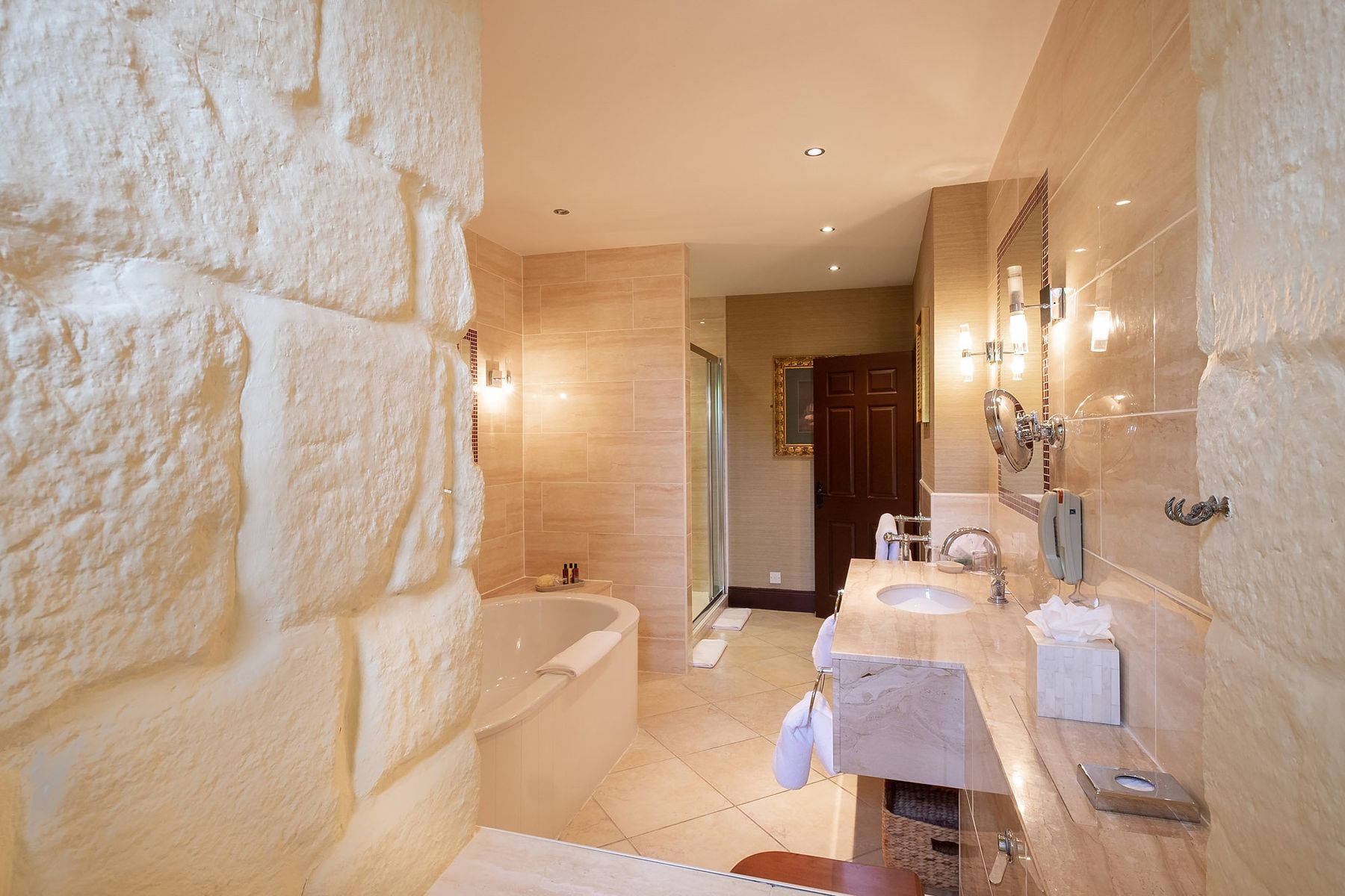 Contemporary bathroom within the medieval walls of Langley Castle Hotel.