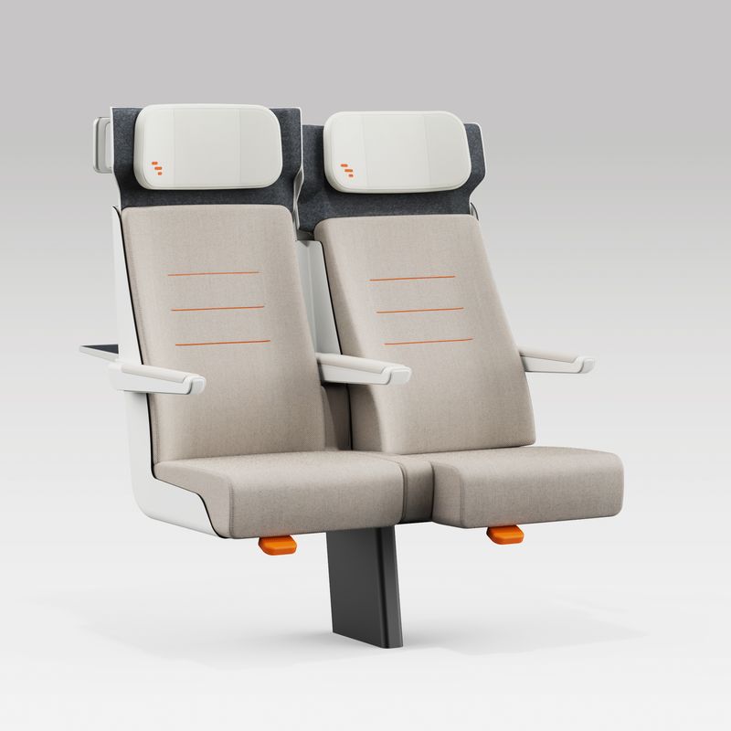 View of a pair of ALIZÉ rail seats with arms in normal position and one chair in a reclining position.