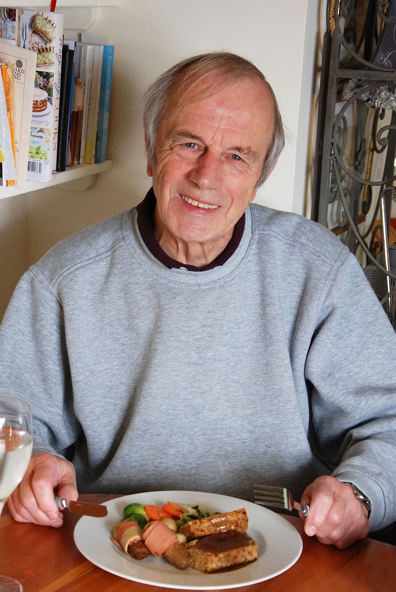 Man eating a vegetarian roast dinner