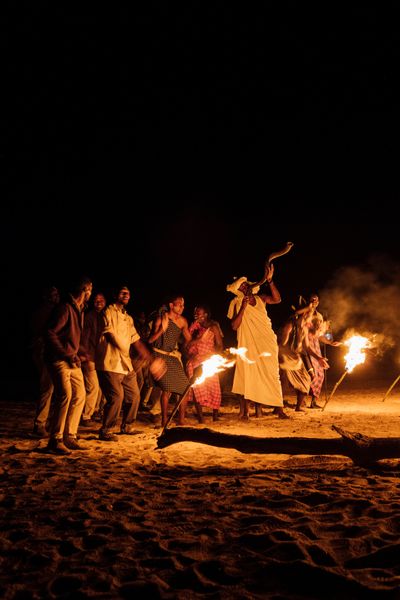 Asilia Africa - Kokoko Camp STZ - Dancing around camp fire.jpg