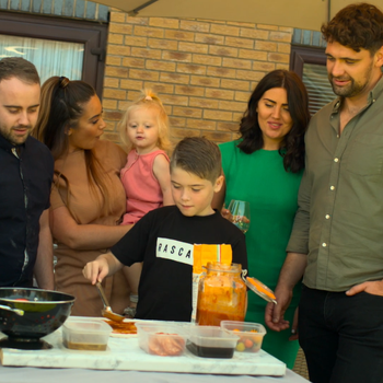 Families bonding over pizza making in a UK garden and with an Orchard Ovens supplied Valoriani pizza oven