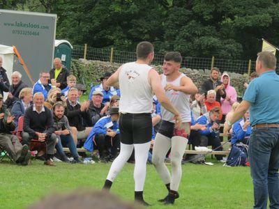 Cumberland and Westmorland wrestler, Thomas Gibson, showing appreciation to his opponent, Jack Ewart,