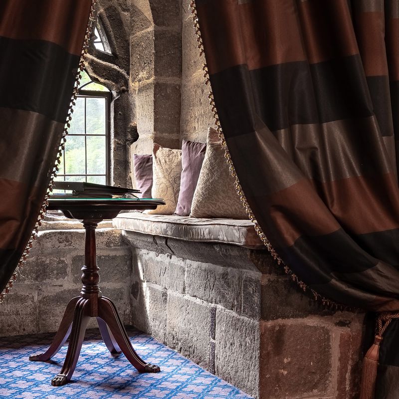 Window seat in bedroom at Langley Castle Hotel, Northumberland, UK