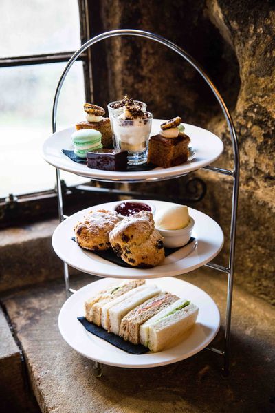 Afternoon tea set into the ancient walls of Langley Castle Hotel, Northumberland