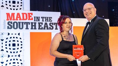 Anni Sanders is presented with Apprentice of the Year award by judge Mr Paul Hetherington