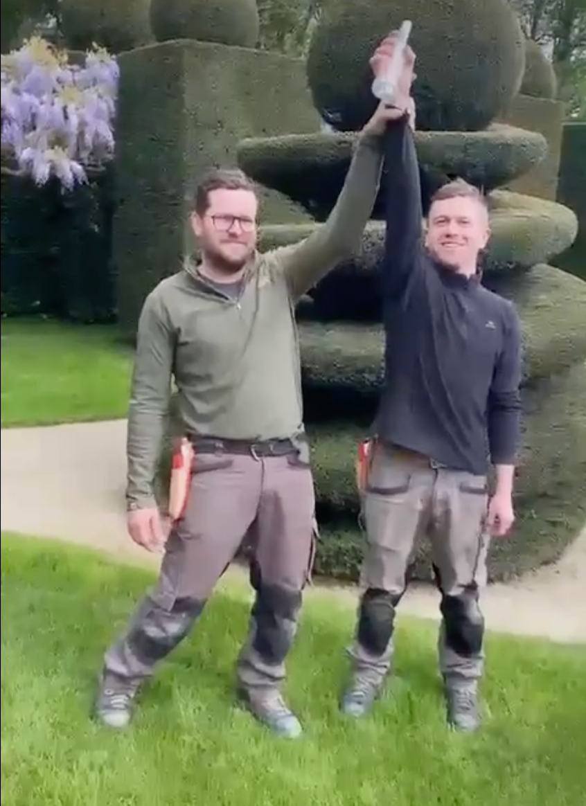 Some of the gardening team at the Chateau et Jardins de la Ballue, in Brittany, with the Topiary Message in a Bottle.