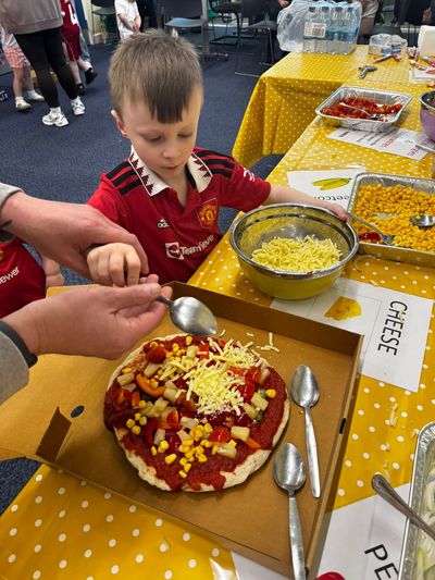 Children making pizza's at YMCA Cheltenham's Easter HAF event in 2026