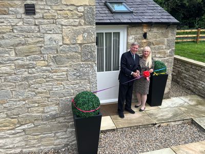 Dr Stuart and Dr Mariann Madnick, Baron and Baroness of Langley, perform the ribbon cutting at Toll Bar Luxury Villa, at Langley Castle, Northumberland, UK
