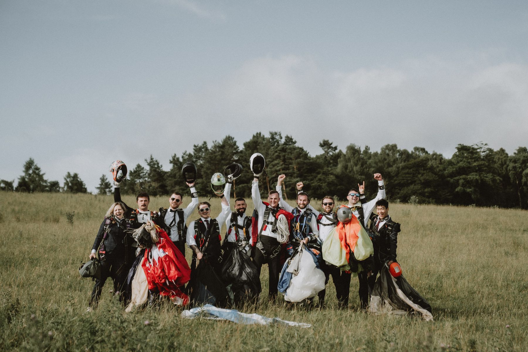 Chris Parkes (centre) with his groomsmen, after all had parachuted into his wedding at Langley Castle Hotel (July 2023)