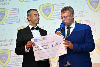 Steve Arnold from WMSAR receives charity donation from Dyslexia Awards host Paul Shuttleworth. .jpg