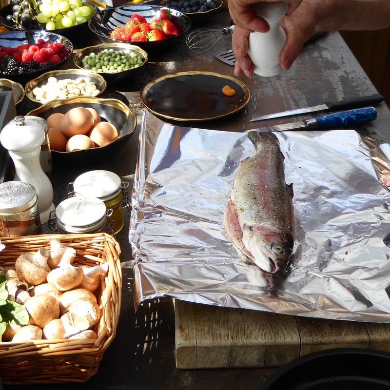 Preparation for an outdoor dining feast using a Valoriani wood-fired oven.