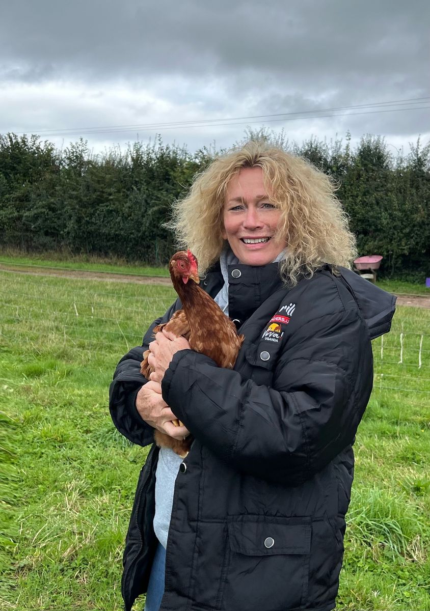 Juliet with rescued hen - Dean Farm, 2024