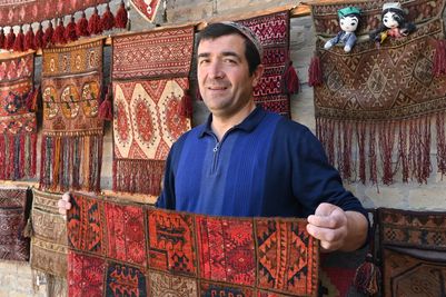 ManLocalPeopleCarpetVendorBukharadreamstimem286923298 (1).jpg