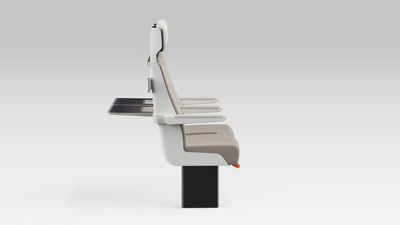 Side profile of a pair of ALIZÉ rail seats with arms in normal position and tables out.