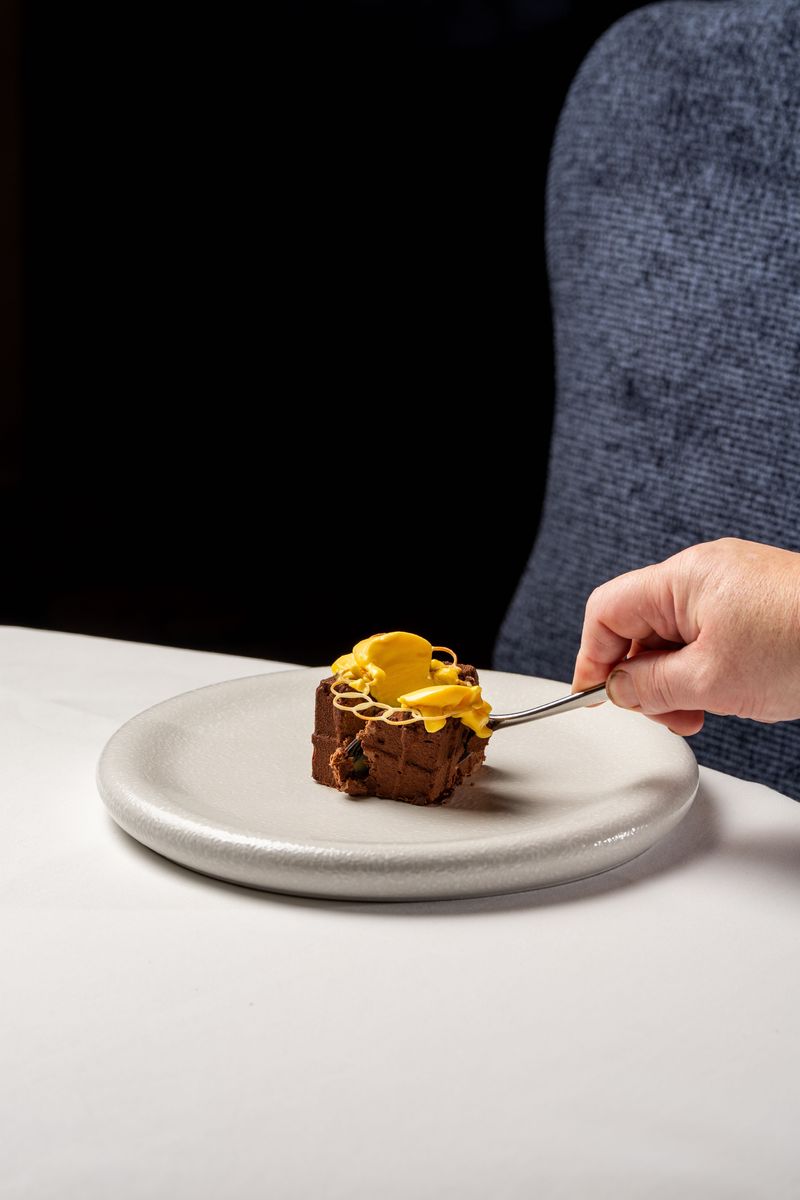 Medieval Langley Castle falls after 676 years - but only in the form of the Dark Chocolate Castle dessert, created as a replica of the castle located in Northumberland, UK, in chocolate mousse.  The dish is the creation of Langley Castle's Culinary Director, Mark Greenaway.