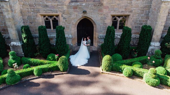 Bride and groom enjoying a July 2021 castle wedding at Langley Castle Hotel, Northumberland.
