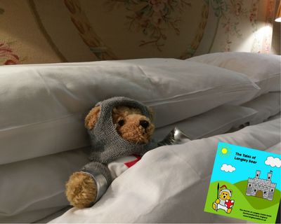 Langley Bear in bed at Langley Castle Hotel, Northumberland, UK.
