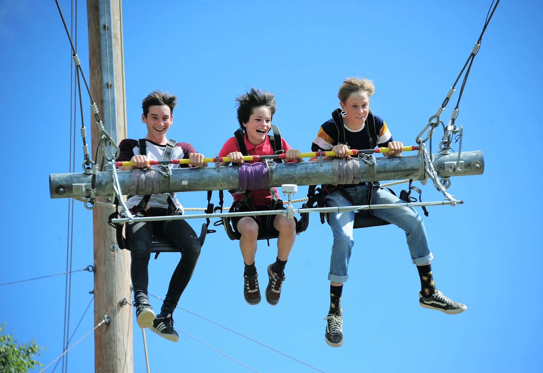 Three boys on the Giant Swing 