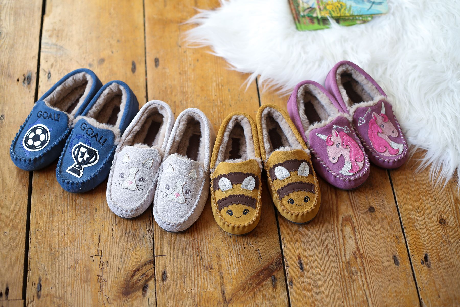 The four new designs added to Start-Rite Shoes soft suede slipper collection for children.