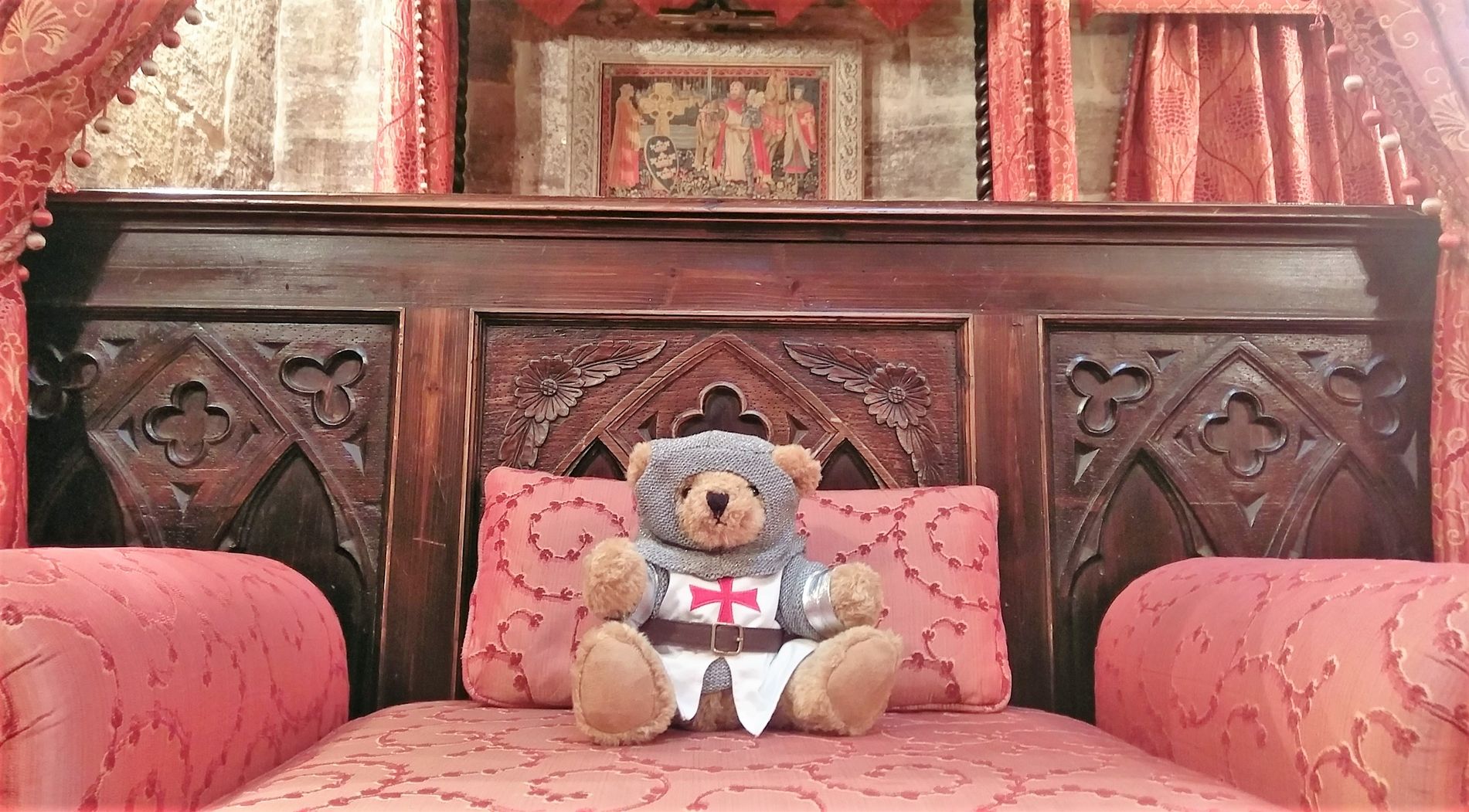 Langley Bear on a bed at Langley Castle Hotel, Northumberland, UK. 