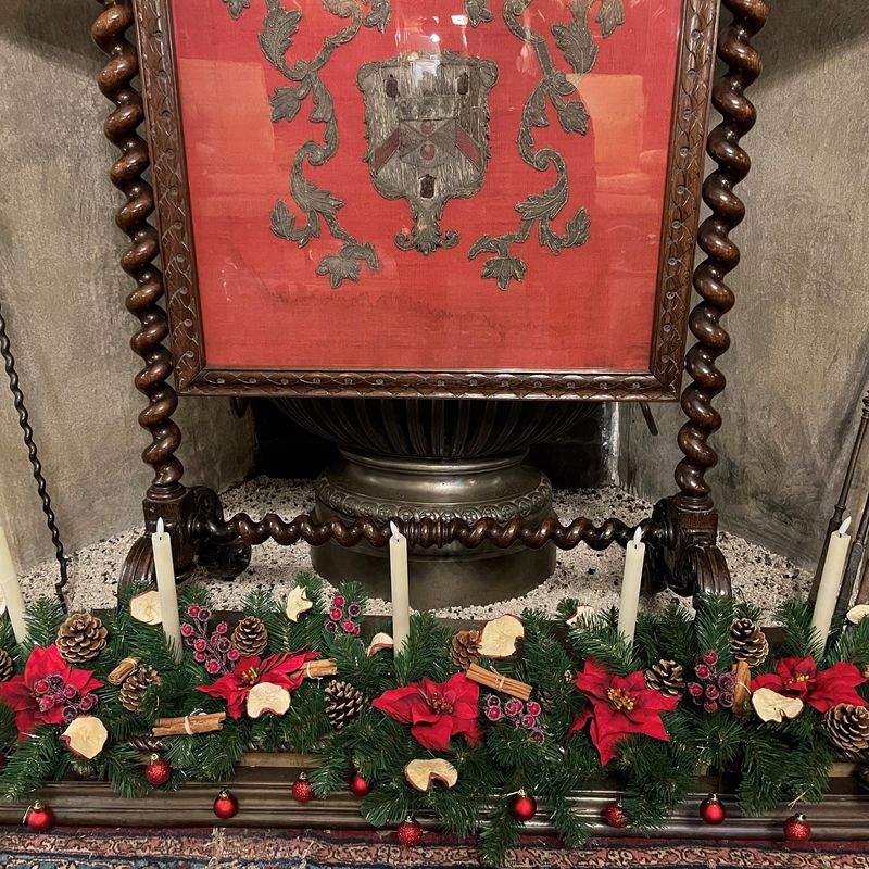 Christmas decor in a fireplace at Levens Hall and Gardens, Cumbria.