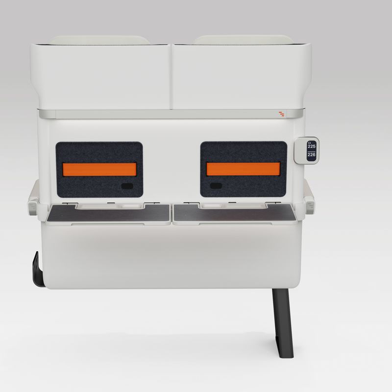 Rear view of a pair of ALIZÉ rail seats with both tables down.  