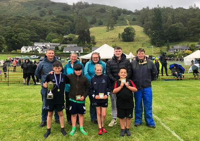 Winner of the Roger Robson Memorial Trophy in the Under 12s Mixed wrestling event, Ollie Stainton 